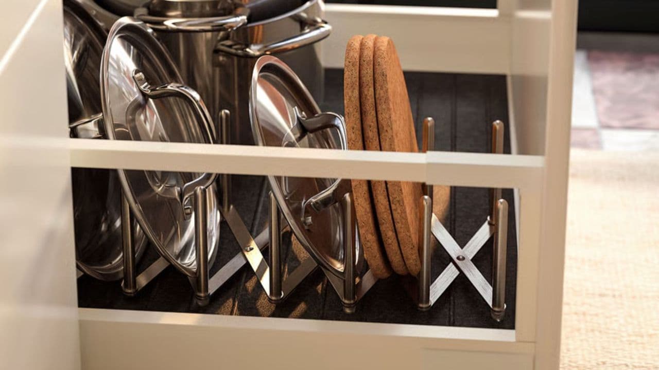IKEA's $7 Stainless Steel Pot Lid Holder Is the Cabinet Organizer You Didn't Know You Needed