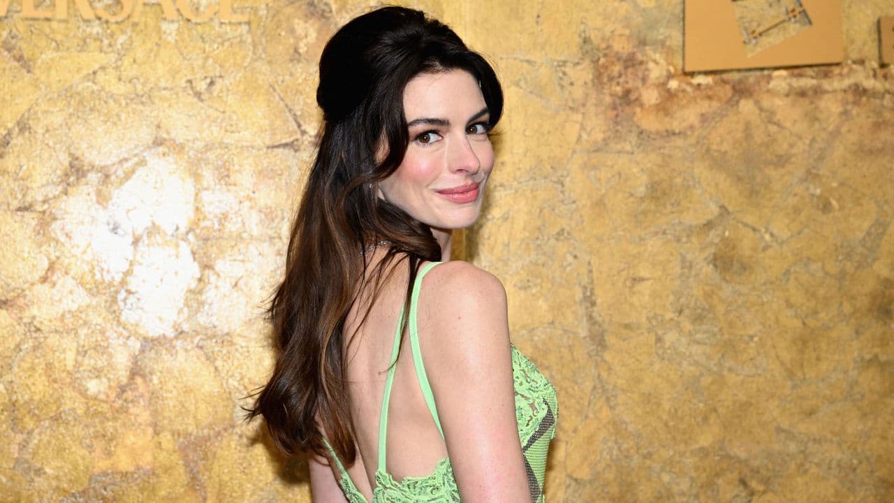 Anne Hathaway's Earthy Green Living Room Corner Perfects the Swiss Chalet Aesthetic – It's the Most Transportive Way to Design in 2026